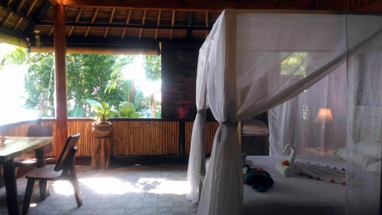 Alam Mimpi Bali Hotel เตจากูลา ภายนอก รูปภาพ